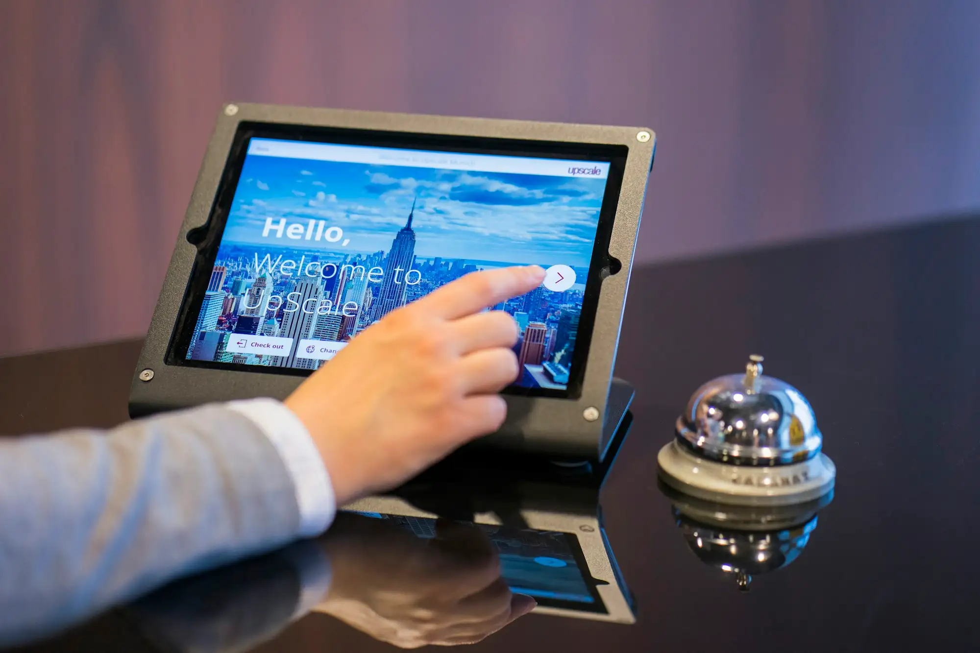 A person about to touch a tablet screen