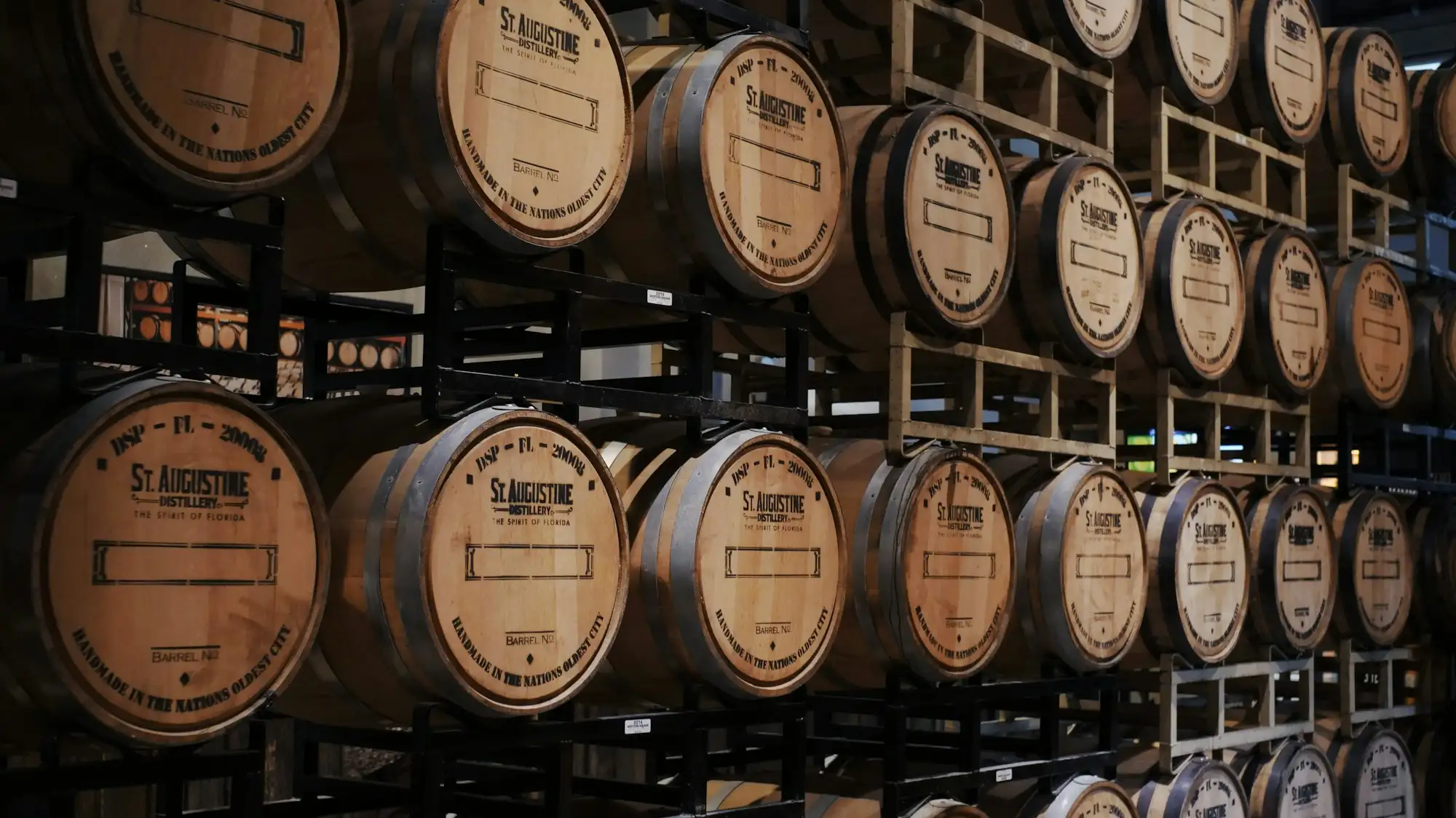 Wooden barrels stacked on racks