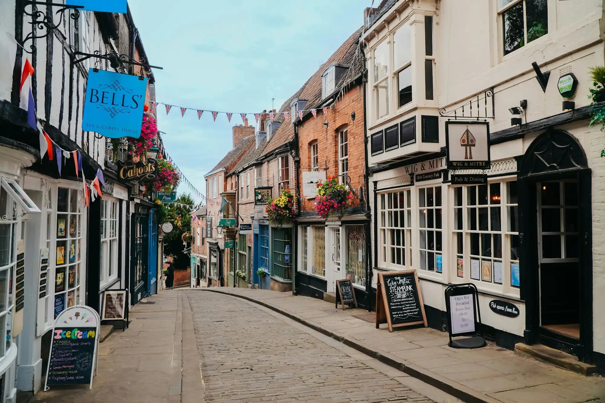 A high street of shops and old buildings